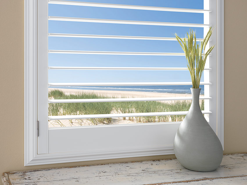 plantation shutters with a 3.5 inch louver by ashade above window fashions