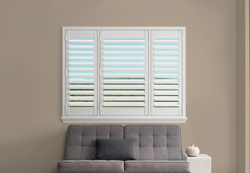 plantation shutters with measured t position by a shade above window fashions